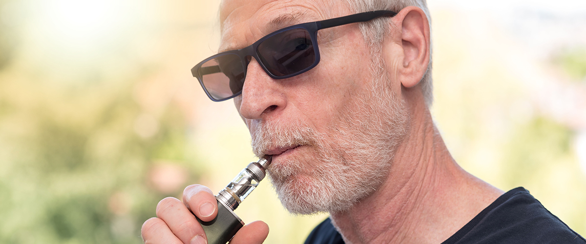 baby boomer man vaping